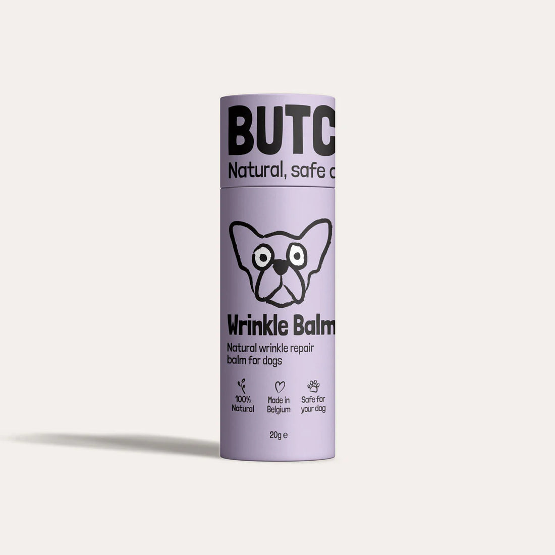Purple cylindrical container of Butch Wrinkle Balm for dogs on a light purple background