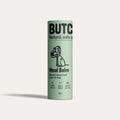 Green balm container labeled 'Butch' on a light gray background