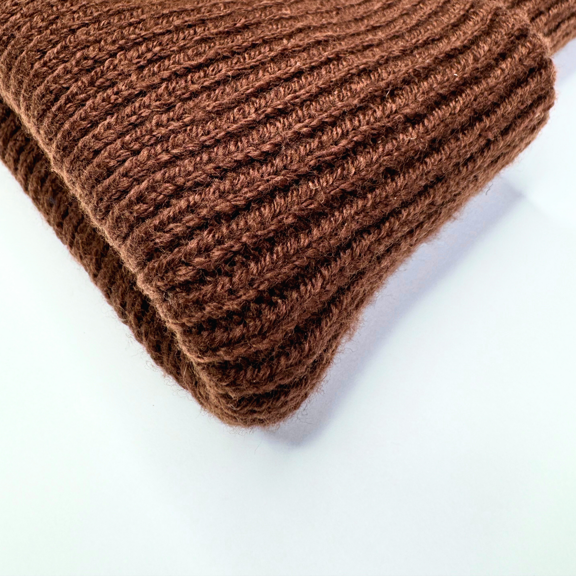 Brown knitted fabric on a white background