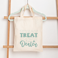 Tote bag with 'Treat Dealer' text on a wooden rack