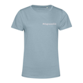 A light blue short-sleeve crewneck t-shirt with the text '#dogmomlife' printed in white on the left chest, displayed on a solid white background.
