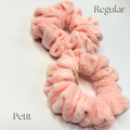 Two pink scrunchies labeled 'Regular' and 'Petit' on a white background